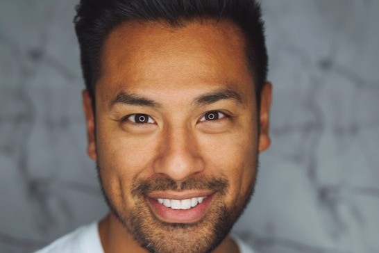 A man smiling, close up